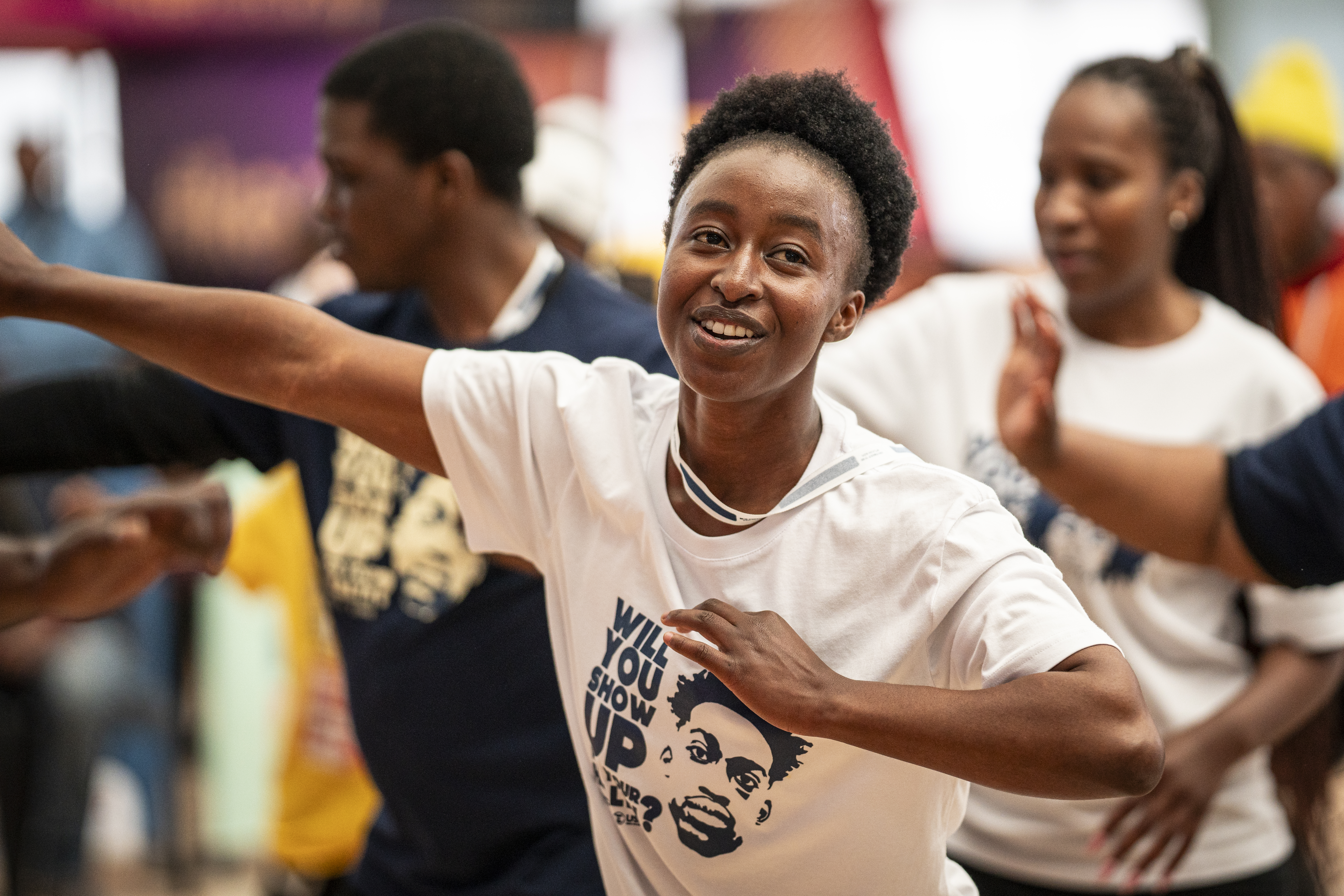 Youth dancing at a health and wellness event.